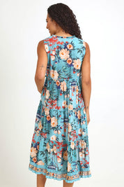 Model Pamelar wearing size 10 of the Sleeveless Layers Dress – Print in colour Print, from the back