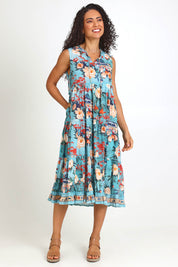 Model Pamelar wearing size 10 of the Sleeveless Layers Dress – Print in colour Print, from the front