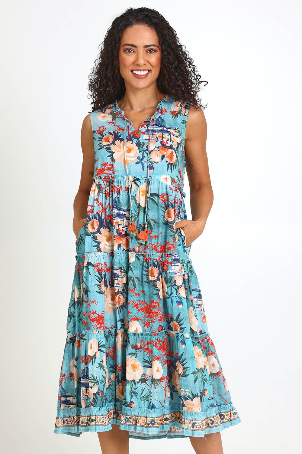 Model Pamelar wearing size 10 of the Sleeveless Layers Dress – Print in colour Print, from the front