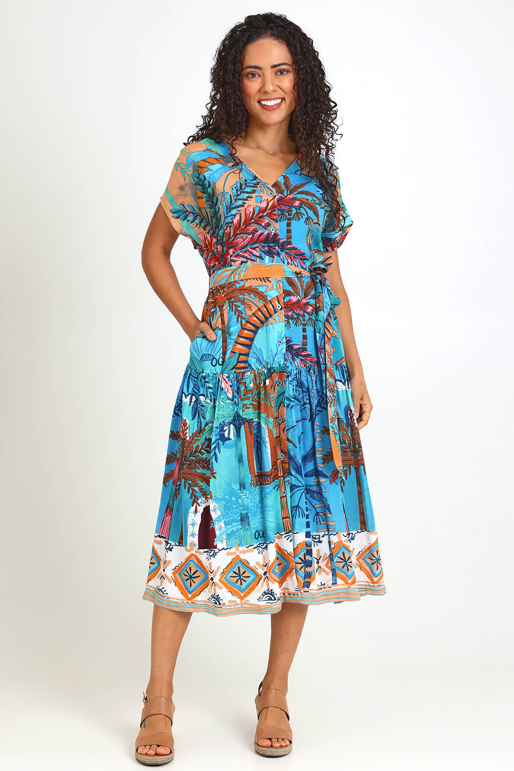 Model Pamelar wearing size 10 of the V-Neck Button Through Dress – Print in colour Print, from the front