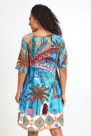 Model Pamelar wearing size 10 of the Contemporary Dress – Print in colour Print, from the back