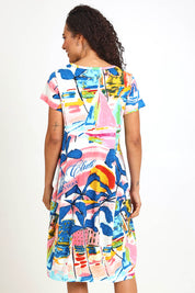 Model Pamelar wearing size 10 of the Bubble Dress – Yacht in colour Yacht, from the back