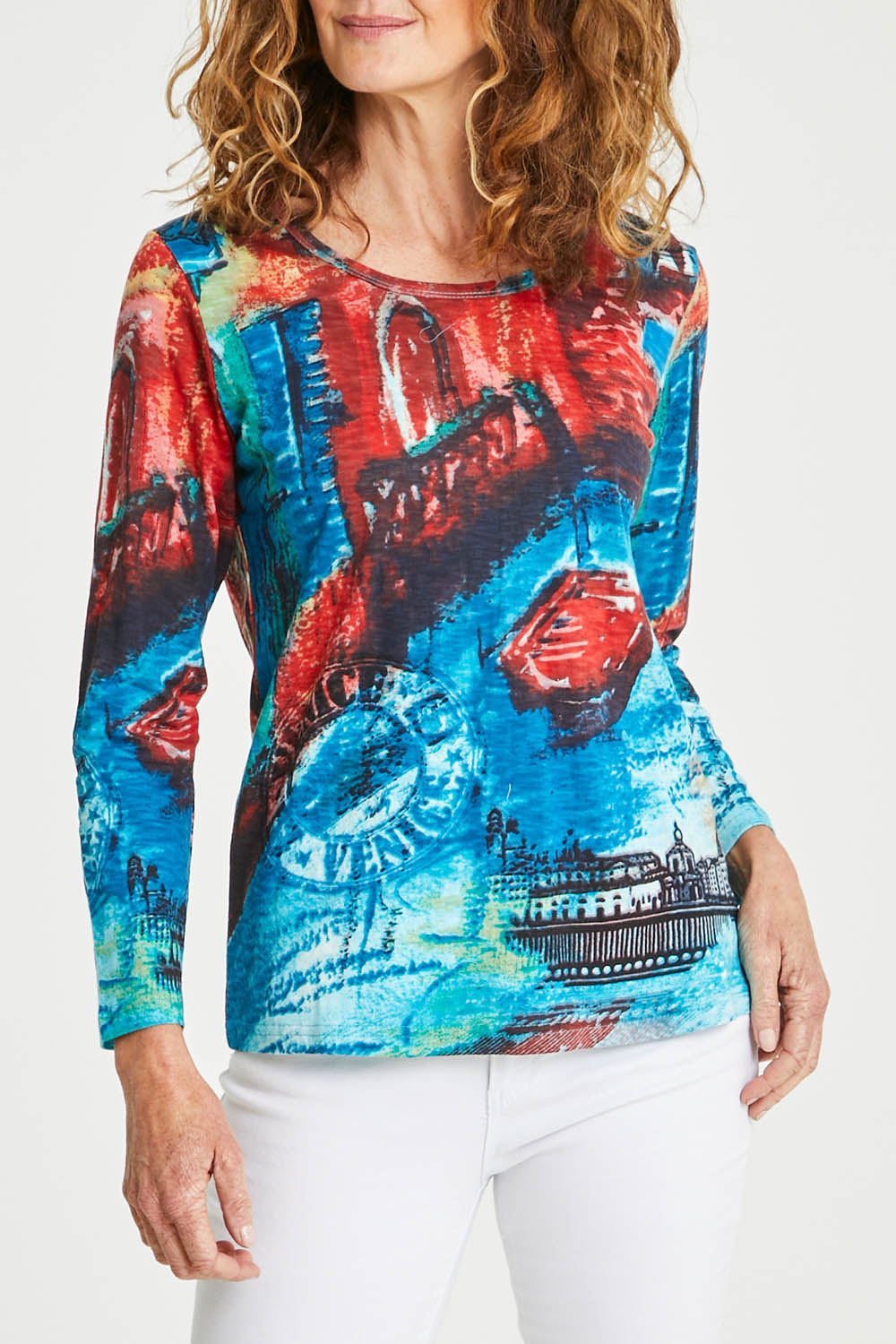 Model Emma wearing size 10 of the Organic Cotton Crew LS Tee in colour Venicemult (Blue), from the front, cropped image