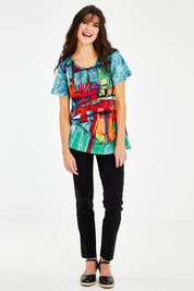 Model Courtney wearing size 10 of the Boats Organic Cotton Tee in colour Boats (Blue), from the front, showing the whole outfit