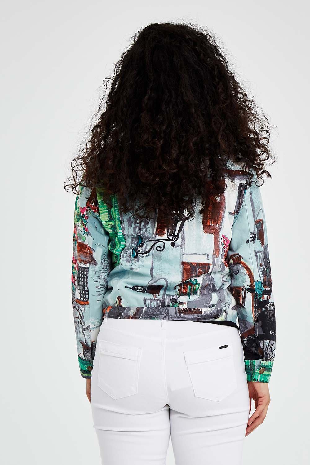 A model wearing size 10 of the Tuscany Cotton Biker Jacket in colour Print (Blue), from the back
