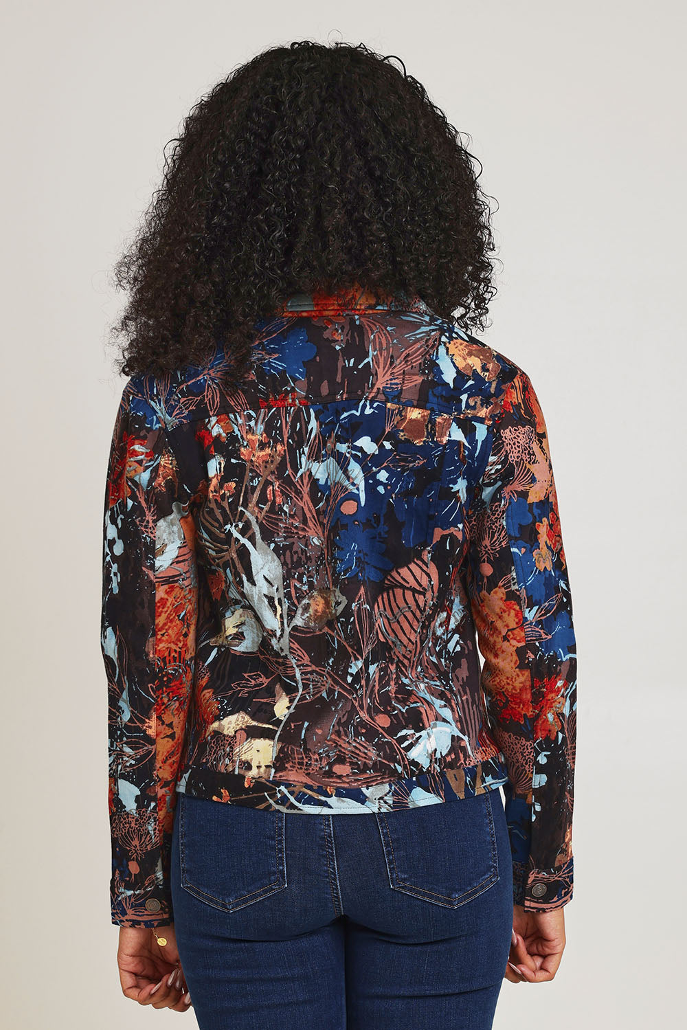 Model Ziara wearing size 10 of the Organic Cotton Biker Jacket in colour Abstract, from the back