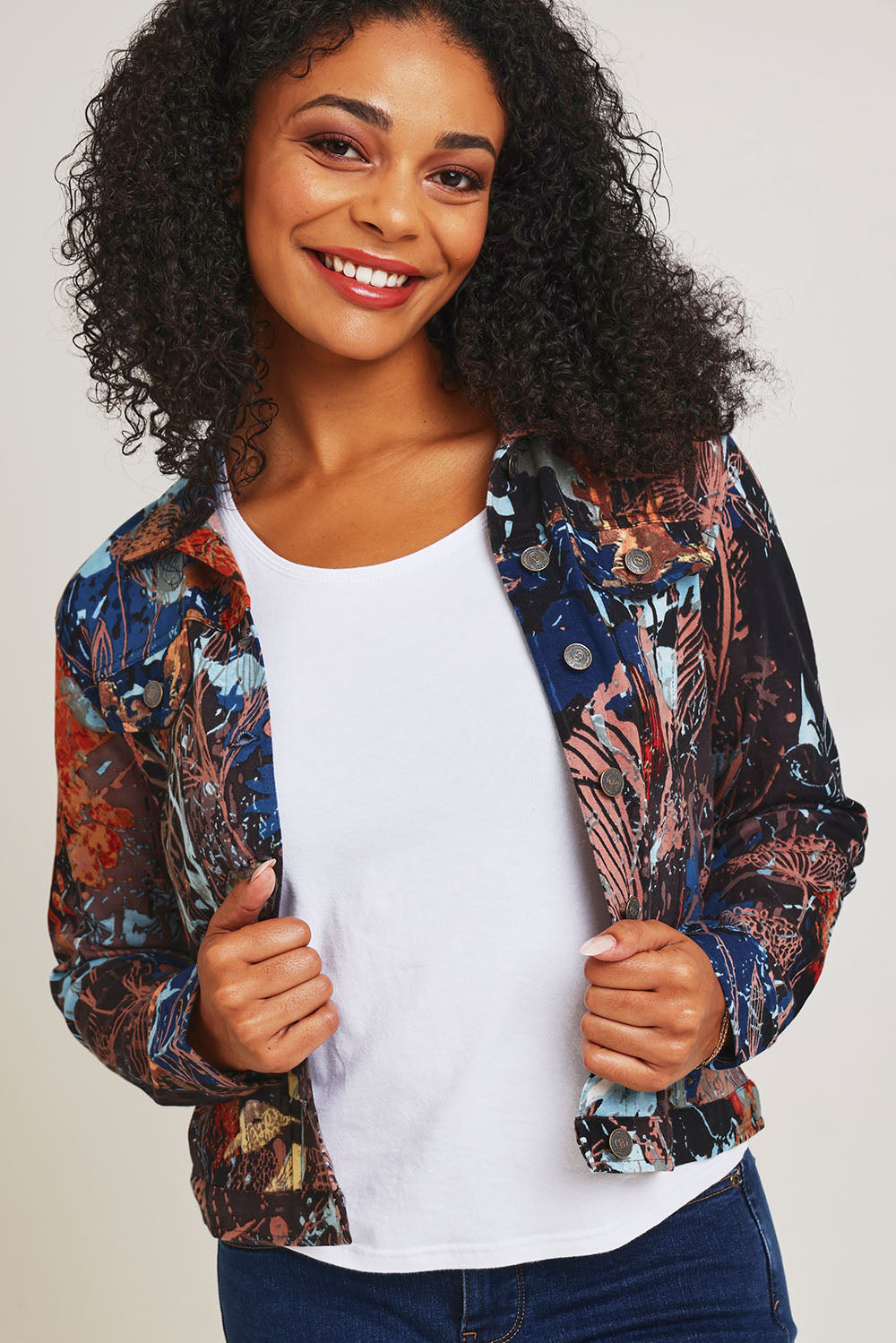 Model Ziara wearing size 10 of the Organic Cotton Biker Jacket in colour Abstract, from the front, cropped image