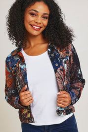 Model Ziara wearing size 10 of the Organic Cotton Biker Jacket in colour Abstract, from the front, cropped image