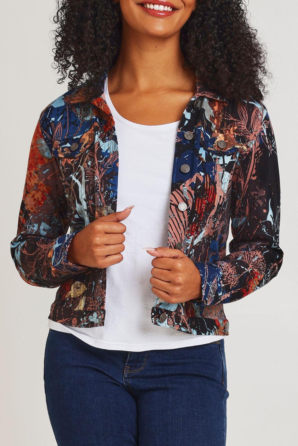 Model Ziara wearing size 10 of the Organic Cotton Biker Jacket in colour Abstract, from the front, cropped image