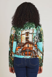 Model Ziara wearing size 10 of the Biker Jacket in colour Alicante (Green), from the back