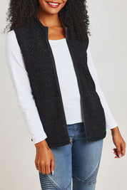 Model Ziara wearing size 10 of the Abstract Reversible Zip Vest in colour Abstract, from the front, cropped image