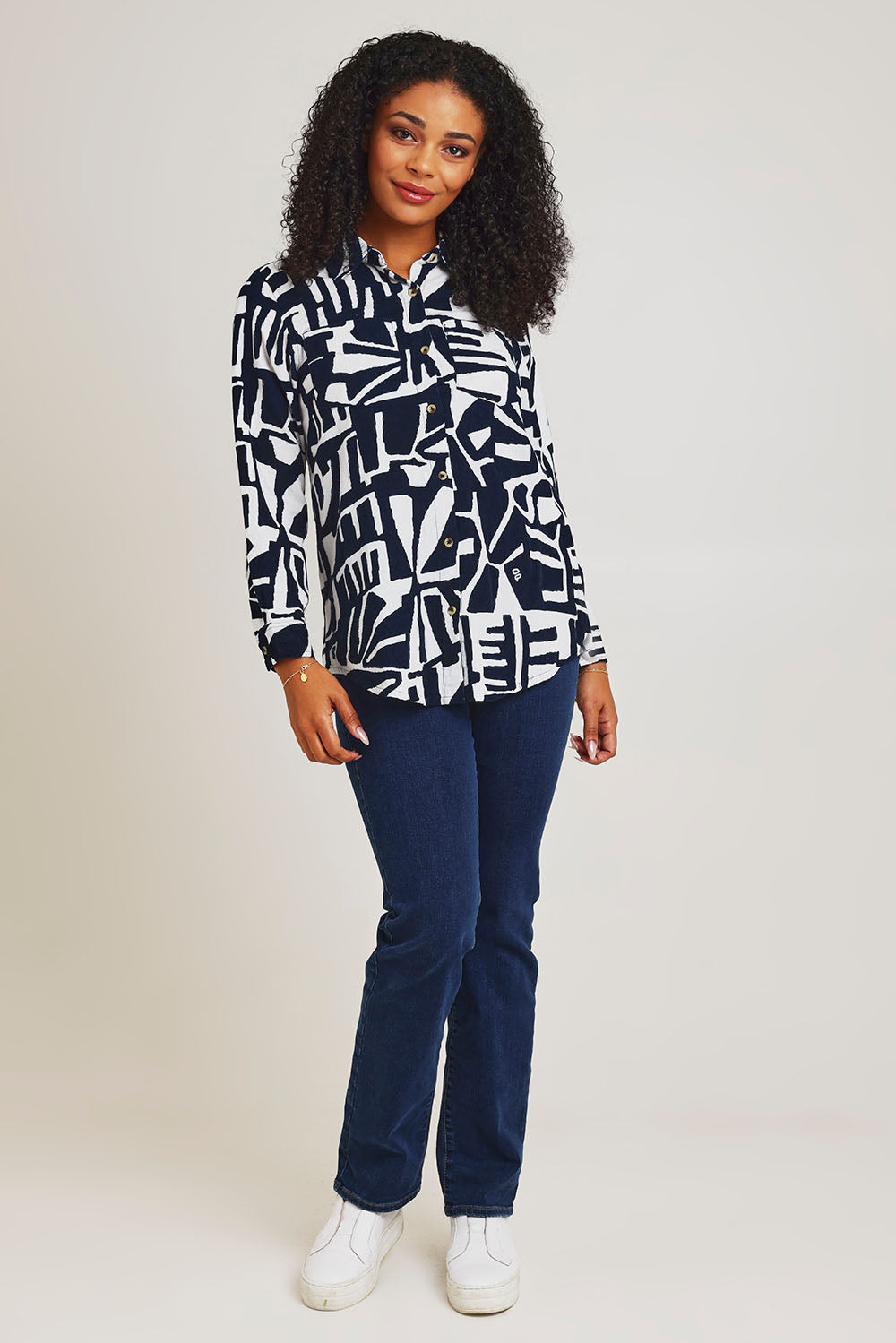 Model Ziara wearing size 10 of the Corduroy Long Shirt in colour Navy (Blue), from the front, showing the whole outfit