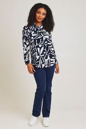 Model Ziara wearing size 10 of the Corduroy Long Shirt in colour Navy (Blue), from the front, showing the whole outfit