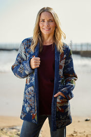 Model Maggie wearing size 10 of the Dancing Queen Reversible Cotton Coat in colour Dancing (Blue), from the front, showing the whole outfit
