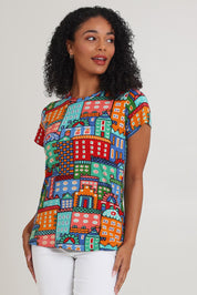 Model Ziara wearing size 10 of the Cotton Blend Crew Tin colourShirt - City, from the front, cropped image