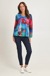 Model Madeline wearing size 10 of the Contemporary V Tee in colour Sailboats (Blue), from the front, showing the whole outfit