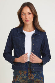 Model Amanda wearing size 10 of the Reversible Jacket in colour Maluku (Blue), from the front, cropped image