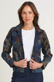 Model Amanda wearing size 10 of the Reversible Jacket in colour Maluku (Blue), from the front, cropped image