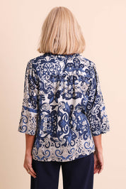 Model Sandys wearing size 10 of the Frill Neckline Cotton Top – Print in colour Print, from the back