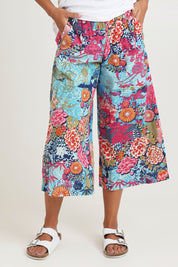 Model Ziara wearing size 10 of the Ikebana Cotton Pant in colour Ikebana, from the front, cropped image