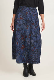 Model Madeline wearing size 10 of the Tabriz Skirt in colour Tabriz (Blue), from the front, cropped image