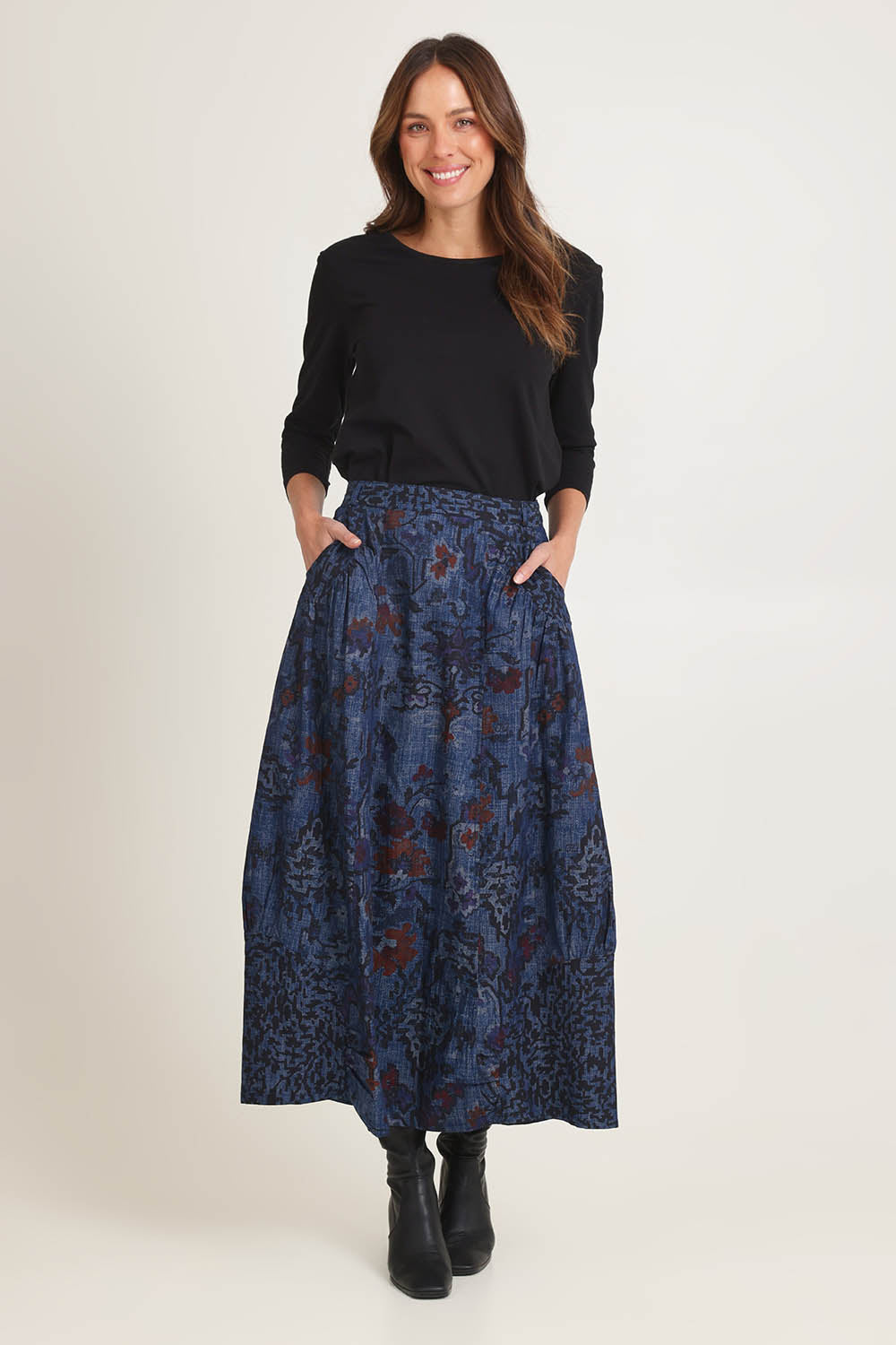 Model Madeline wearing size 10 of the Tabriz Skirt in colour Tabriz (Blue), from the front, showing the whole outfit