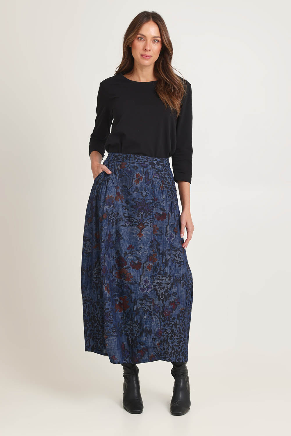Model Madeline wearing size 10 of the Tabriz Skirt in colour Tabriz (Blue), from the front, showing the whole outfit