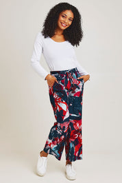 Model Ziara wearing size 10 of the Rivers Of Babylon Cord Pant in colour Babylon, from the front, showing the whole outfit
