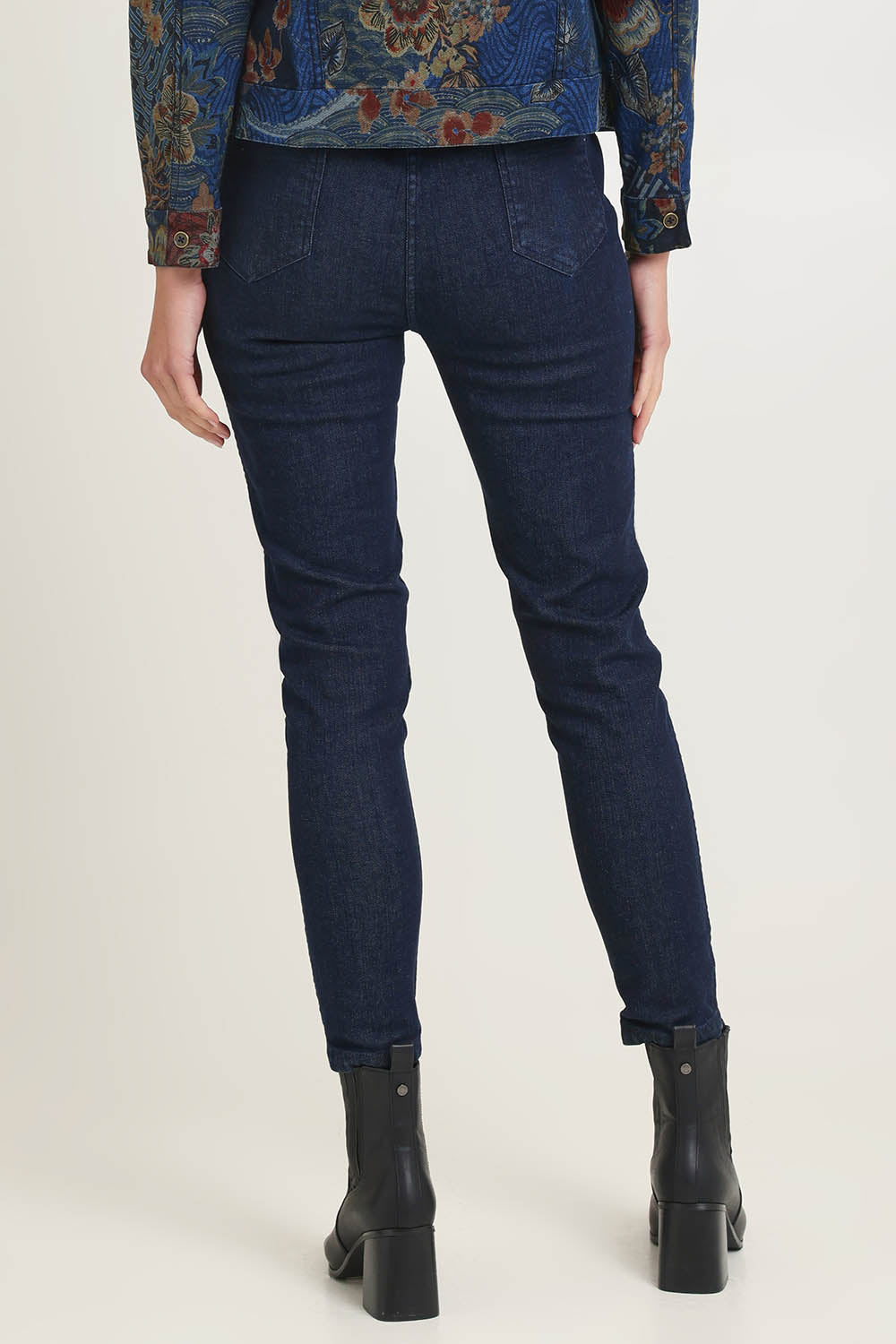 Model Madeline wearing size 10 of the Reversible Jeans in colour Maluku (Blue), from the back