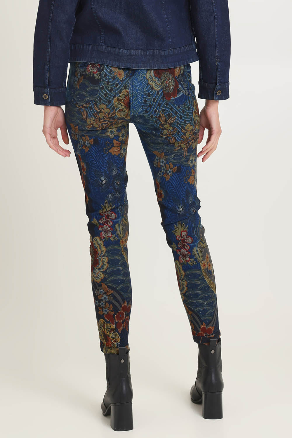 Model Madeline wearing size 10 of the Reversible Jeans in colour Maluku (Blue), from the back