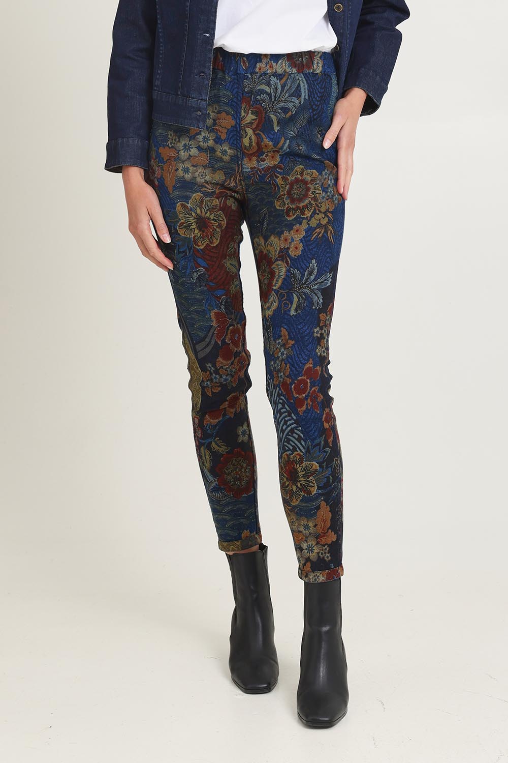 Model Madeline wearing size 10 of the Reversible Jeans in colour Maluku (Blue), from the front, cropped image