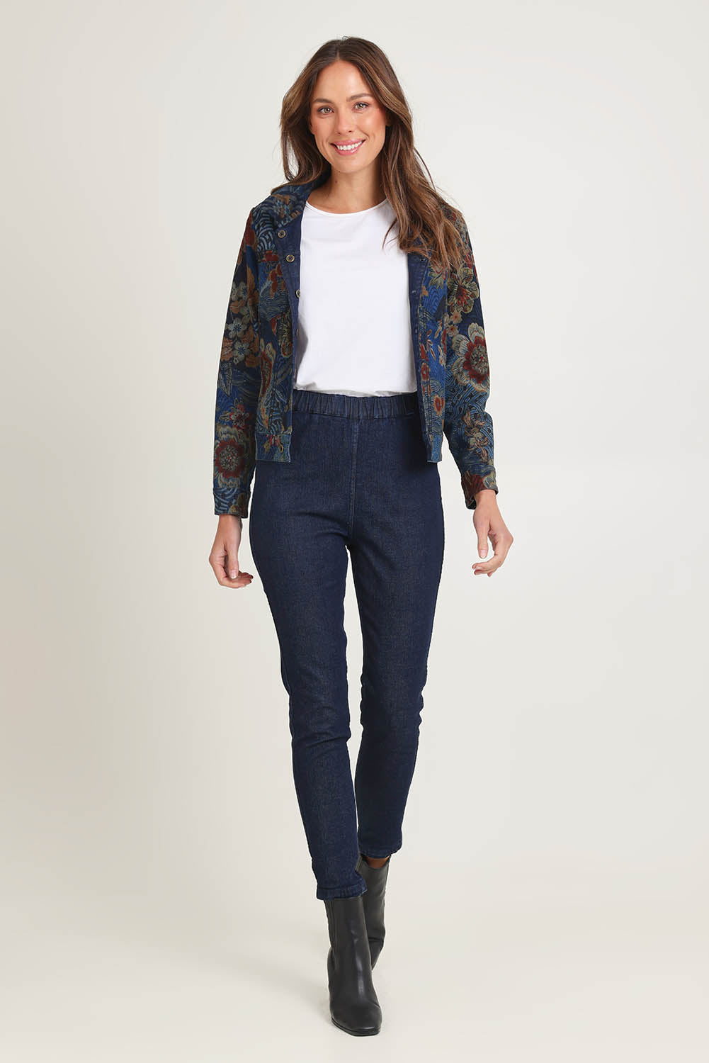 Model Madeline wearing size 10 of the Reversible Jeans in colour Maluku (Blue), from the front, showing the whole outfit