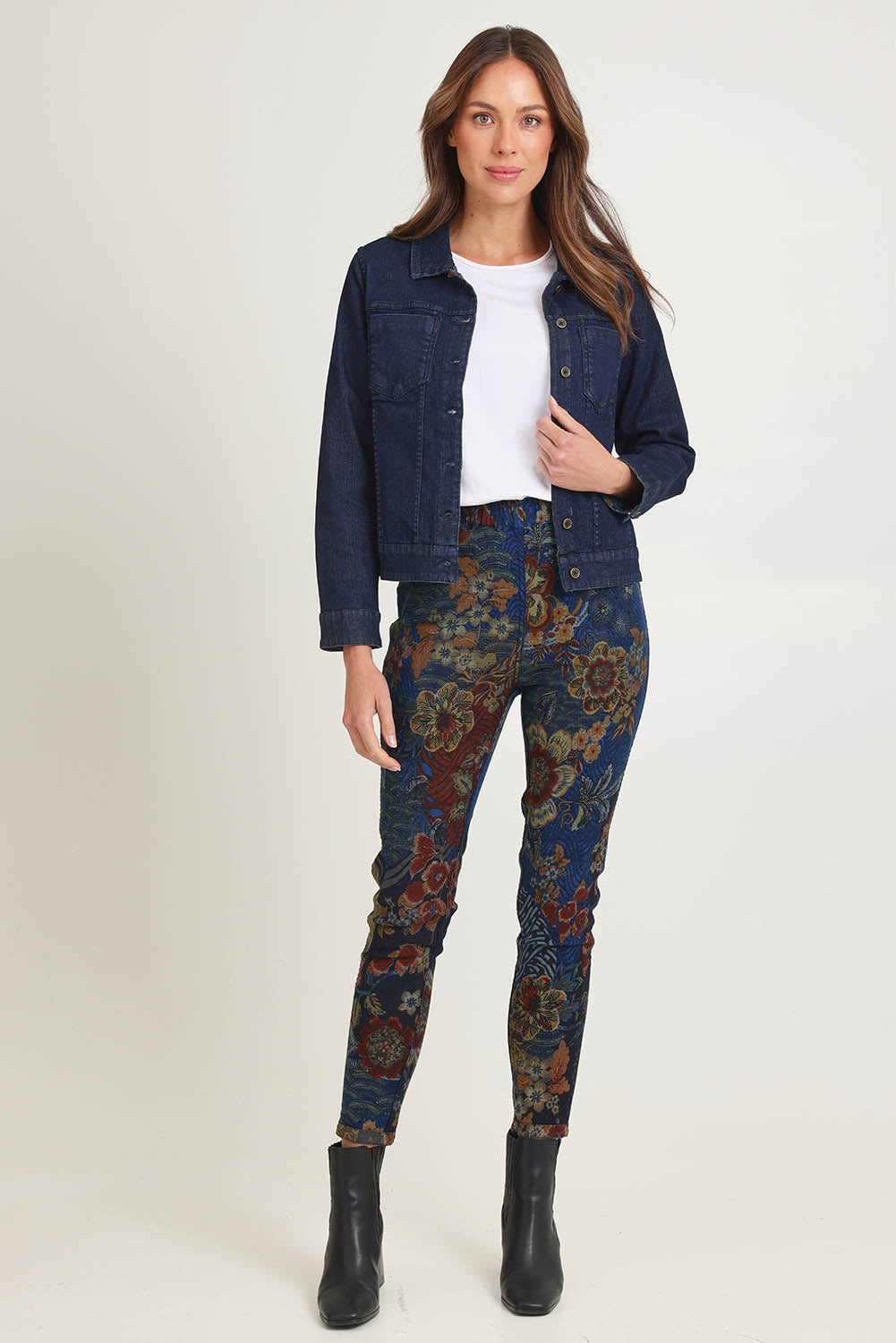 Model Madeline wearing size 10 of the Reversible Jeans in colour Maluku (Blue), from the front, showing the whole outfit
