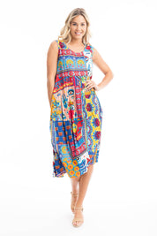 A model wearing the Amritsar Organic Cotton Bubble Sleeveless Dress in colour Print (Blue), from the front, showing the whole outfit