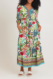 Model Ziara wearing size 10 of the V Trim Maxi Dress in colour Ovahe, from the front, cropped image