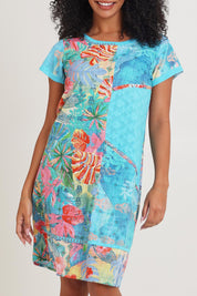 Model Ziara wearing size 10 of the Cotton Patch Dress in colour Malvinas, from the front, cropped image