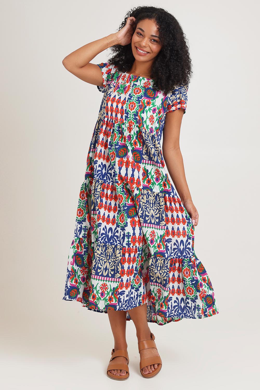 Model Ziara wearing size 10 of the Square Neckline Layers Cotton Dress in colour Buzios, from the front, showing the whole outfit