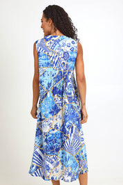 Model Pamelar wearing size 10 of the Pleated Maxi Dress – Print in colour Print, from the front