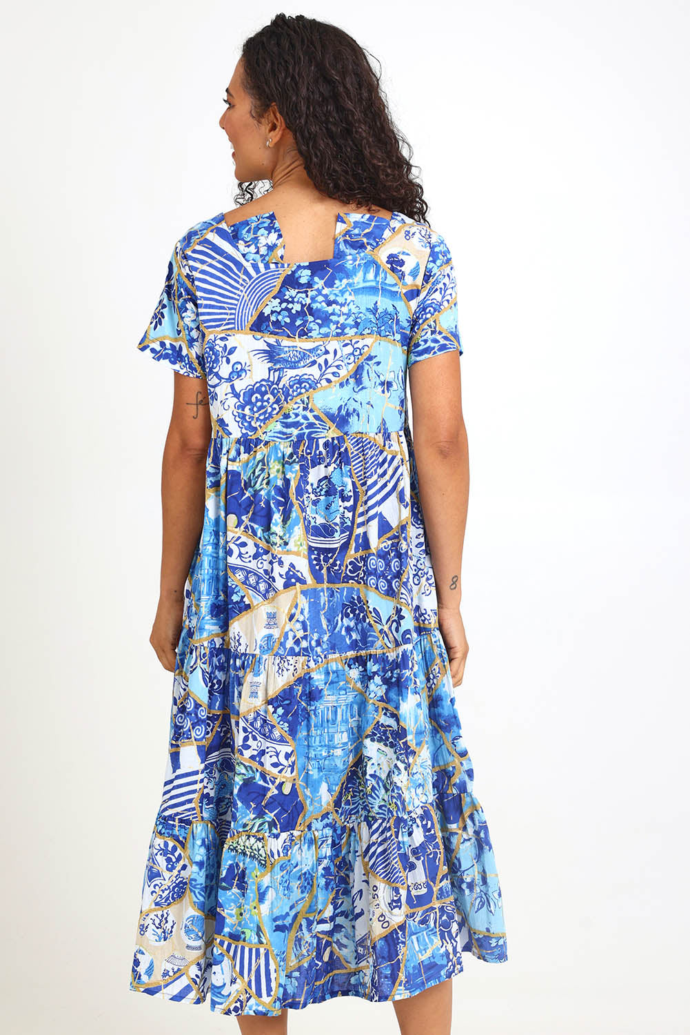 Model Pamelar wearing size 10 of the Square Neckline  Midi Dress – Print in colour Print, from the back