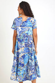 Model Pamelar wearing size 10 of the Square Neckline  Midi Dress – Print in colour Print, from the back