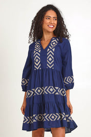 Model Pamelar wearing size 10 of the Essentials Embroidered Layers Cotton Dress - Navy in colour Navy, in a cropped view