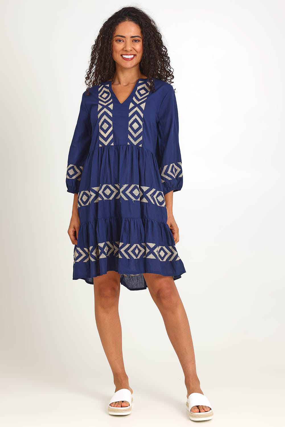 Model Pamelar wearing size 10 of the Essentials Embroidered Layers Cotton Dress - Navy in colour Navy, from the front