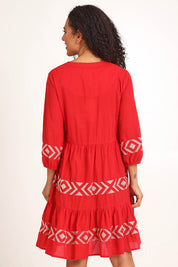 Model Pamelar wearing size 10 of the Essentials Embroidered Layers Cotton Dress - Red in colour Red, from the back