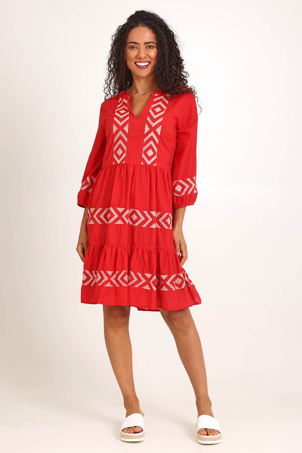 Model Pamelar wearing size 10 of the Essentials Embroidered Layers Cotton Dress - Red in colour Red, from the front