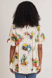 Model Ziara wearing size 10 of the Frill Top in colour Guatemala, from the back
