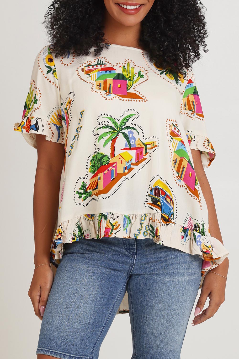 Model Ziara wearing size 10 of the Frill Top in colour Guatemala, from the front, cropped image