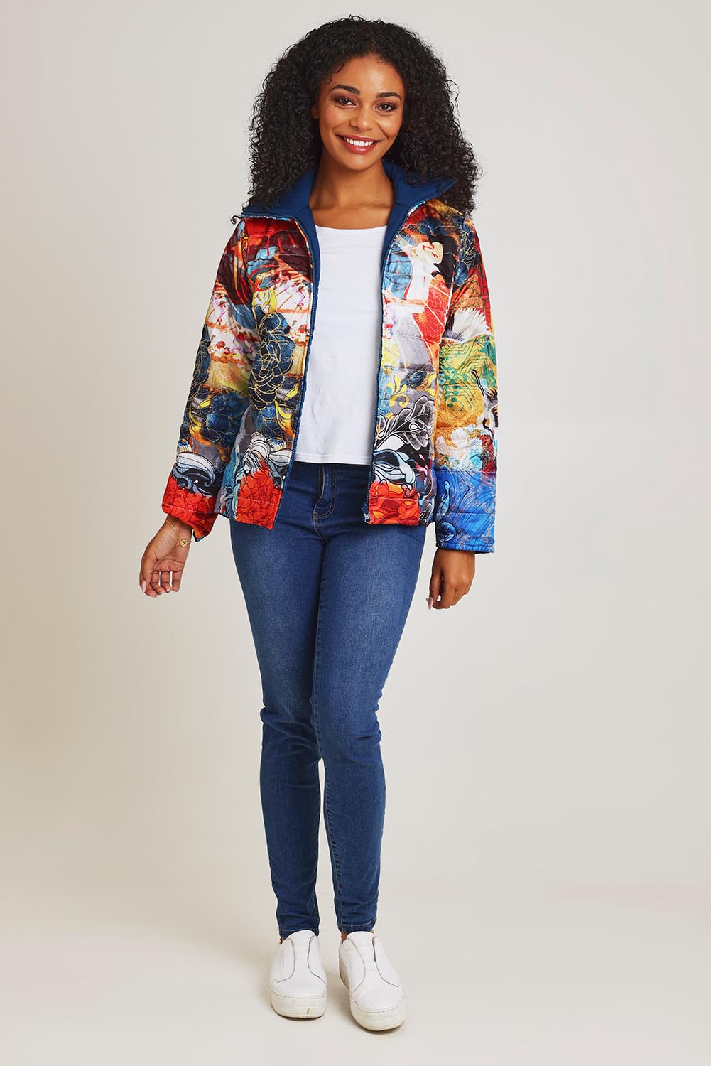 Model Ziara wearing size 10 of the Oriental Nights Puffer Reversible Coat in colour Oriental, from the front, showing the whole outfit