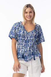 A model wearing the Frill Neckline Cotton Top in colour Buzios, from the front, cropped image