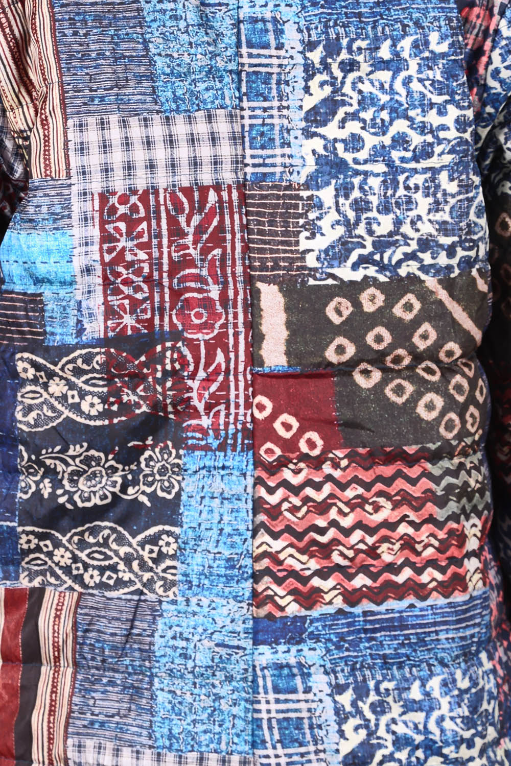 Product shot of the Kantha Reversible Patch Puffer Coat in colour Kantha (Blue), detail