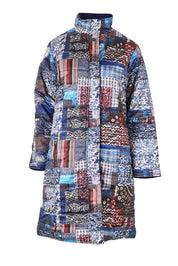 Product shot of the Kantha Reversible Patch Puffer Coat in colour Kantha (Blue), from the front